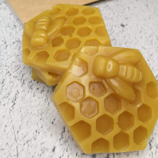 A piece of beeswax and pine resin, intended for renewing old Bee Wax canvas